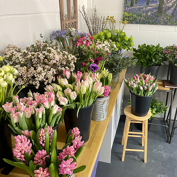 Buckets of flowers by Bluebell Lane floristry Cambridge